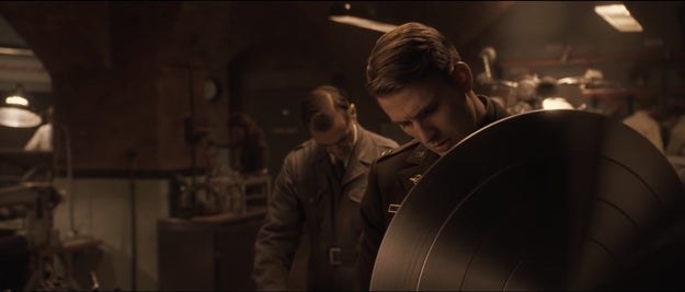 Captain America looking at shield