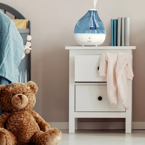 A humidifier on a nightstand