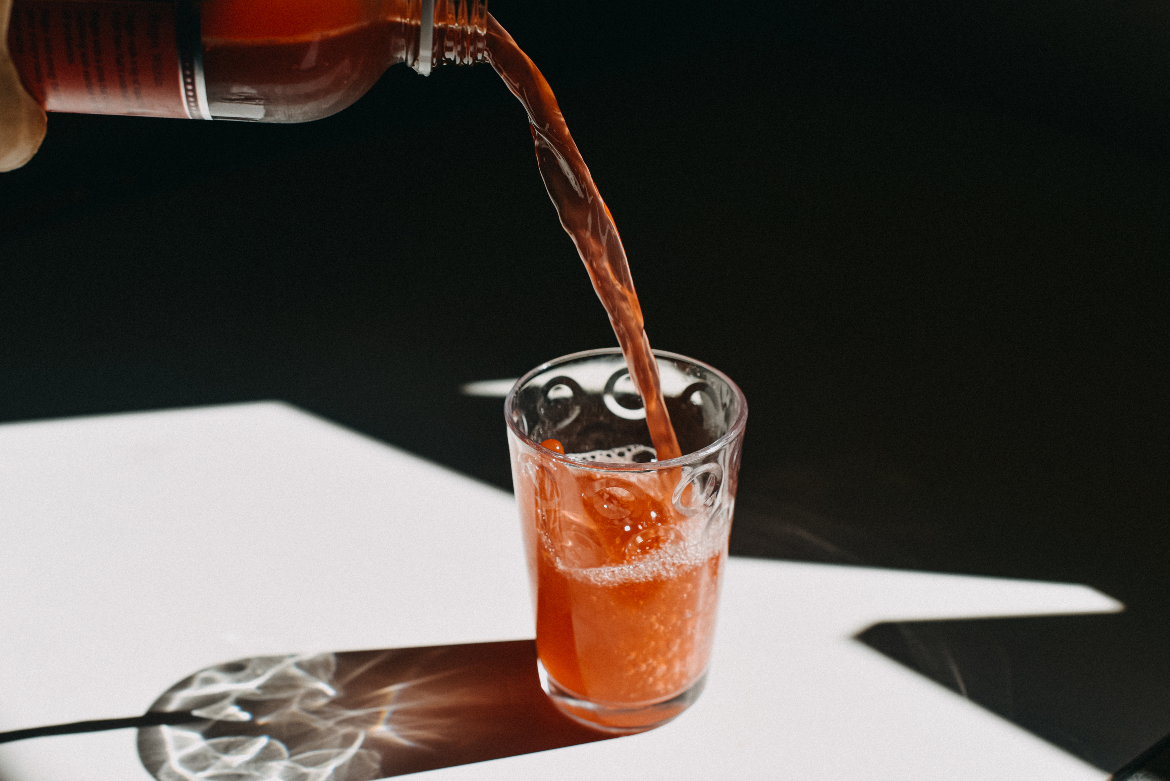 Kombucha being poured into a glass