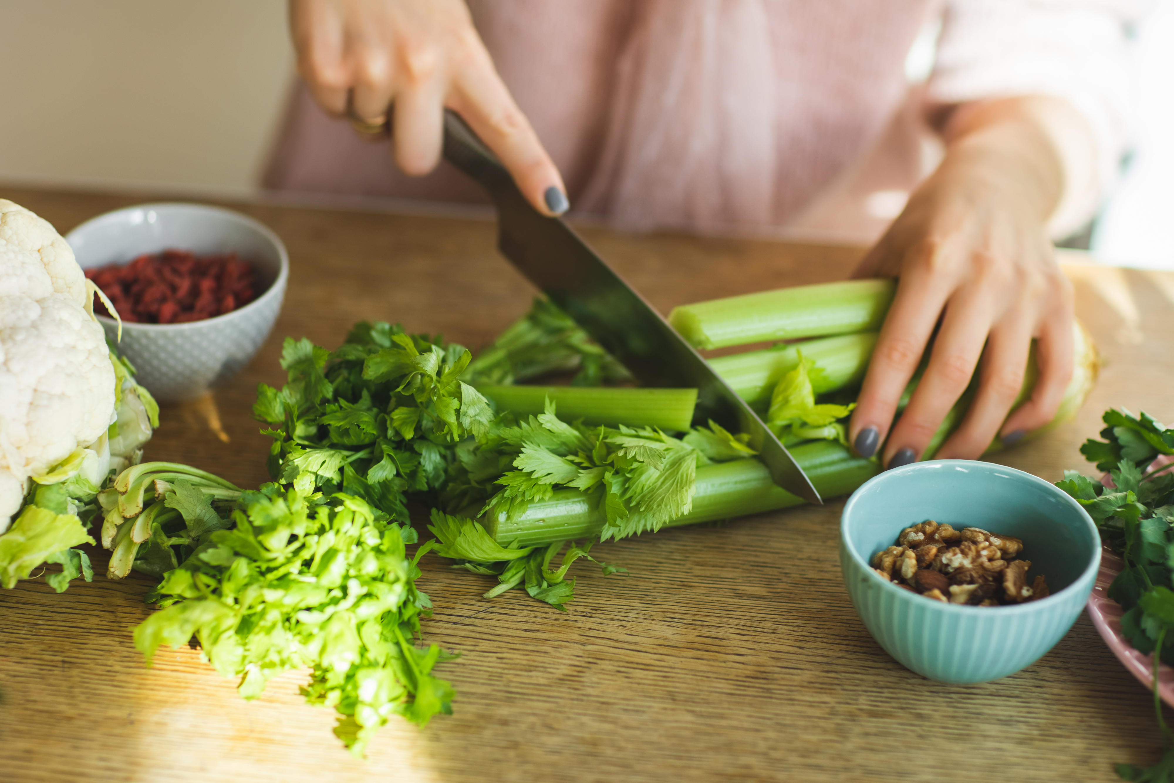 someone cutting Celery