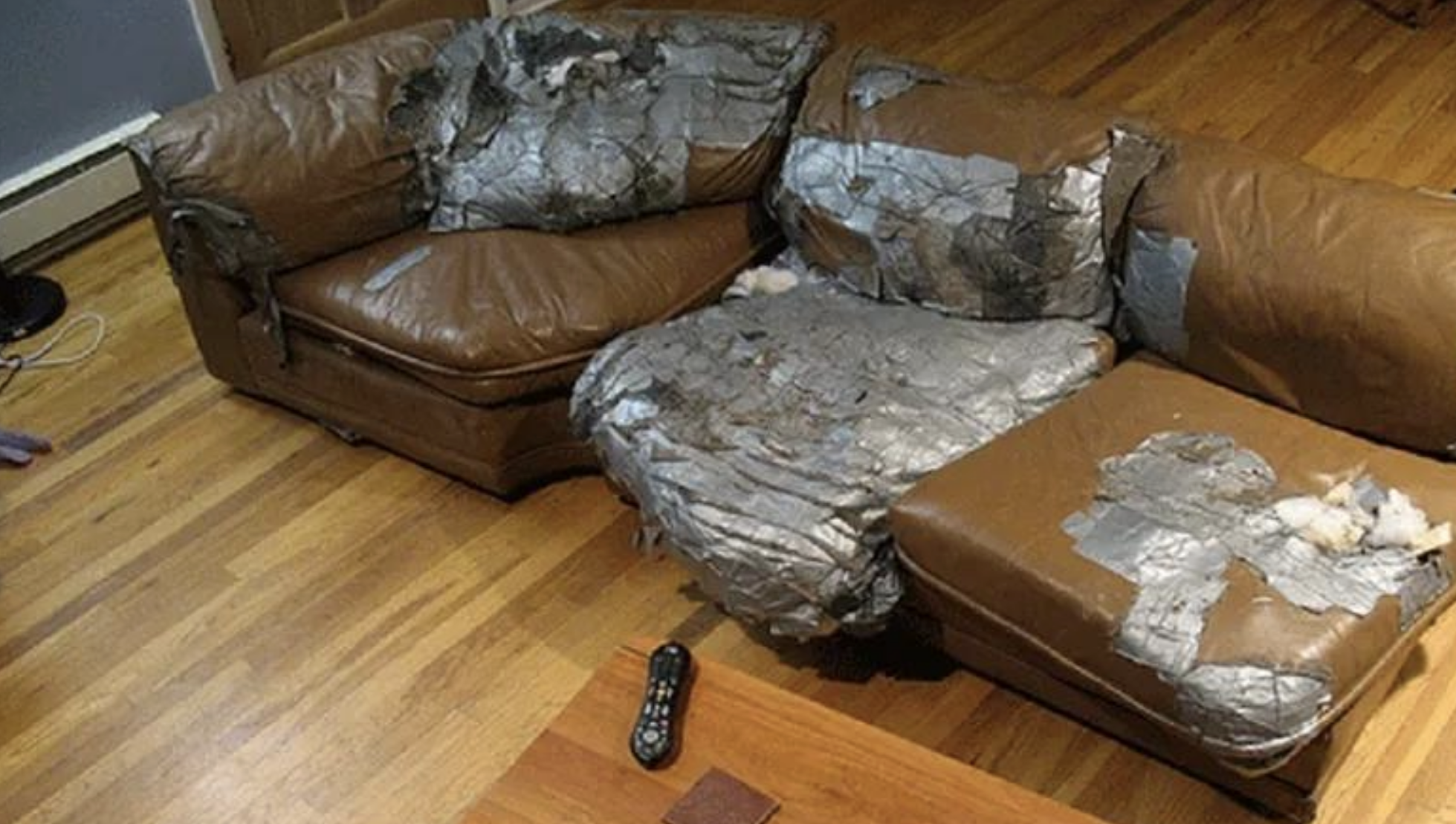leather couch covered in duct tape