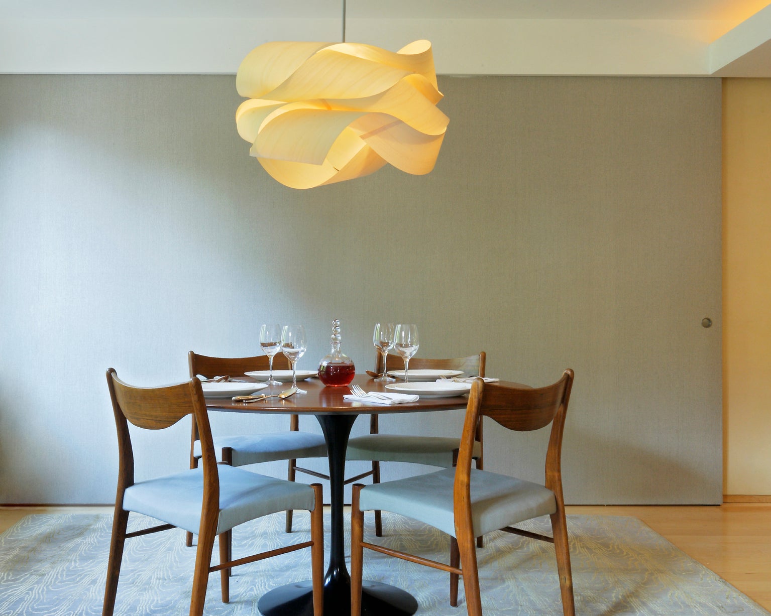 A large light fixture above a dining table