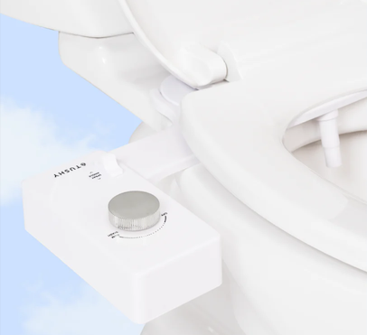 Close-up of a Tushy bidet knob