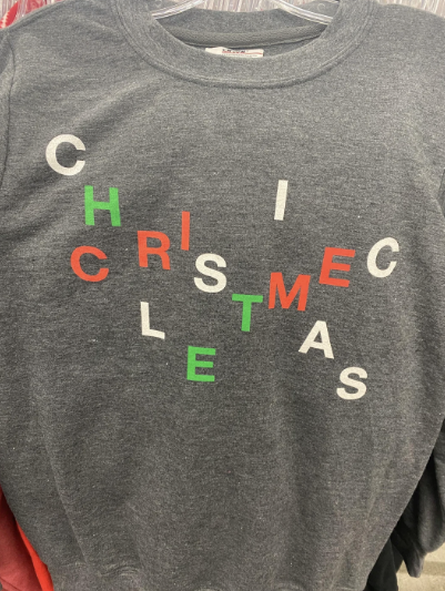 A Christmas shirt with the letters arranged terribly