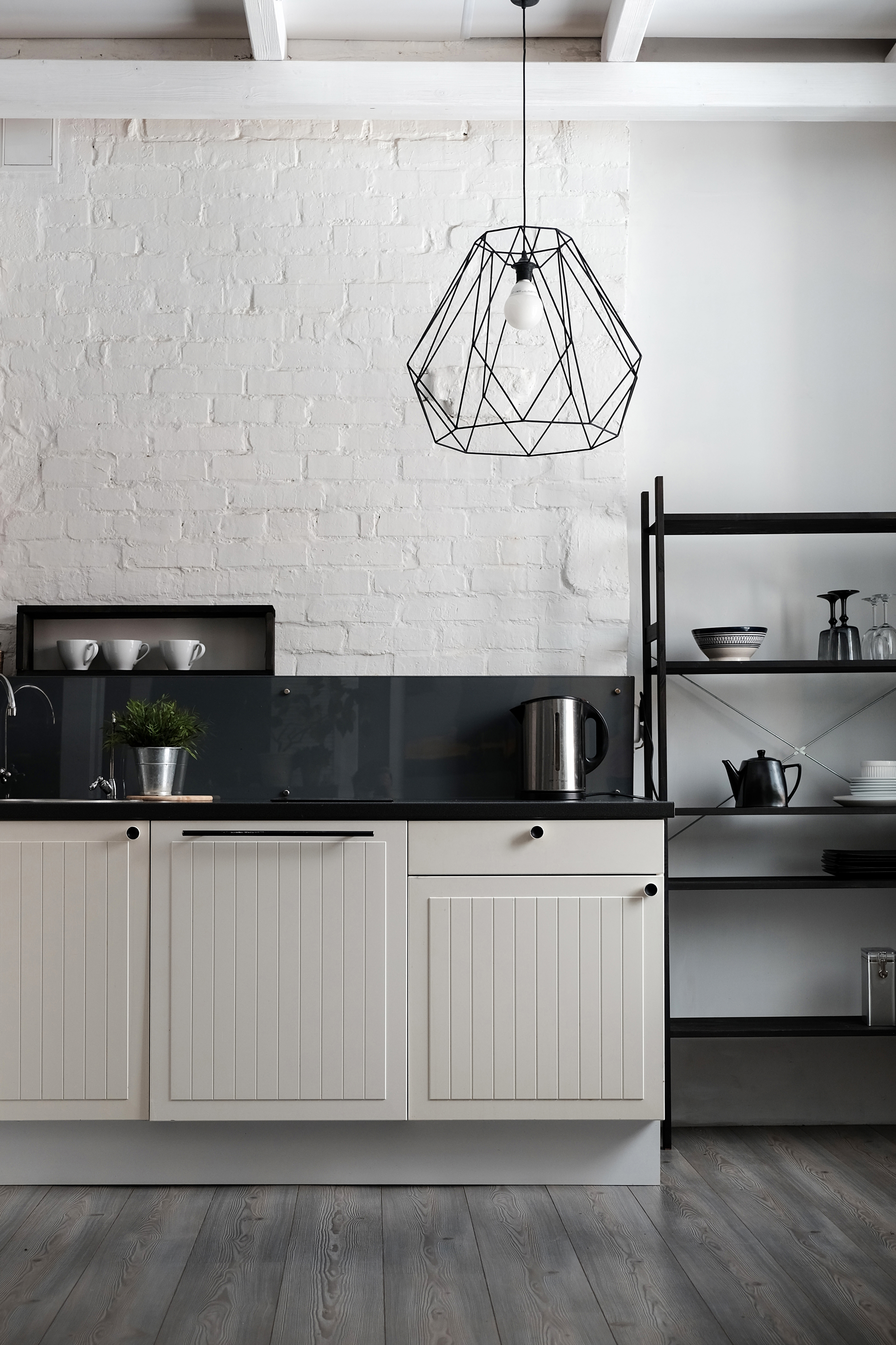 white painted brick wall in a kitchen