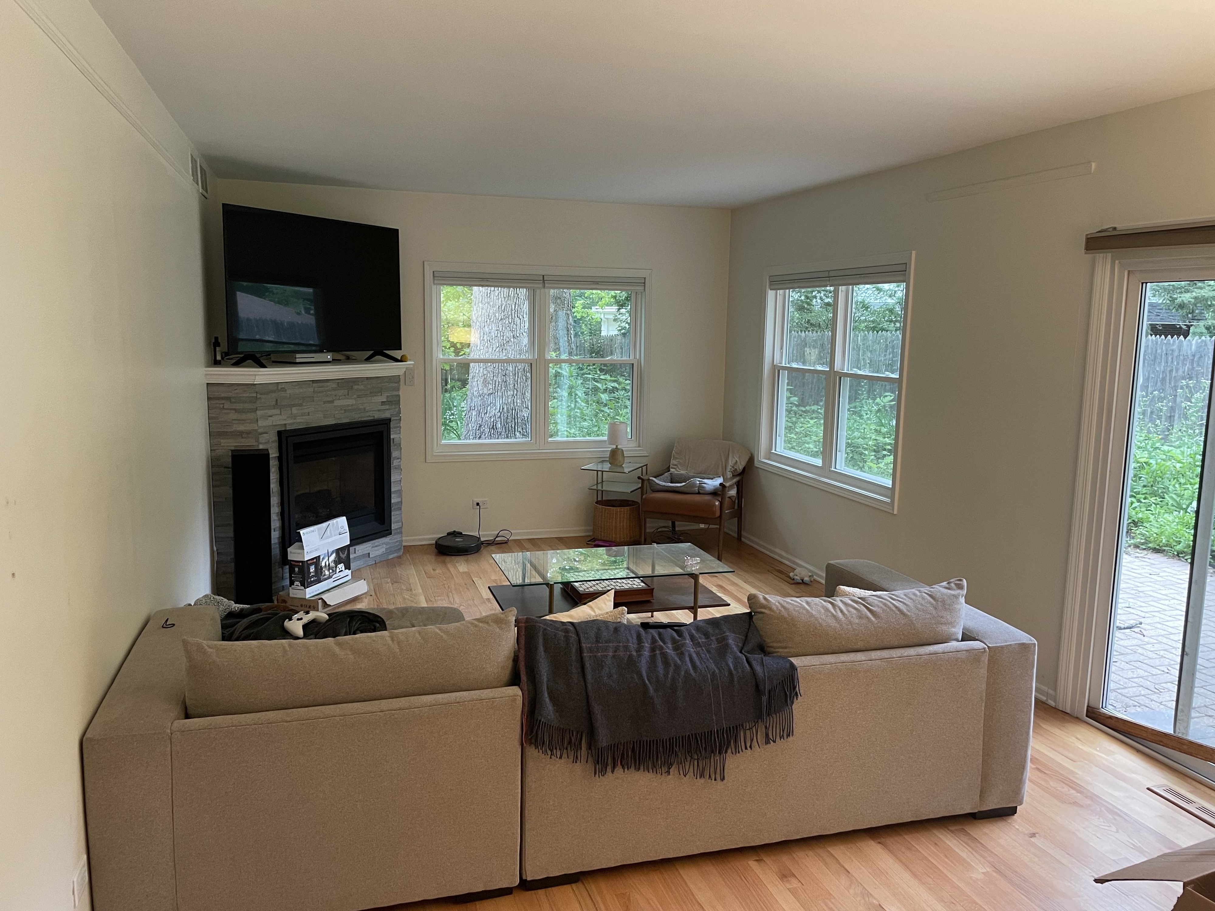 TV above the fireplace in a living room