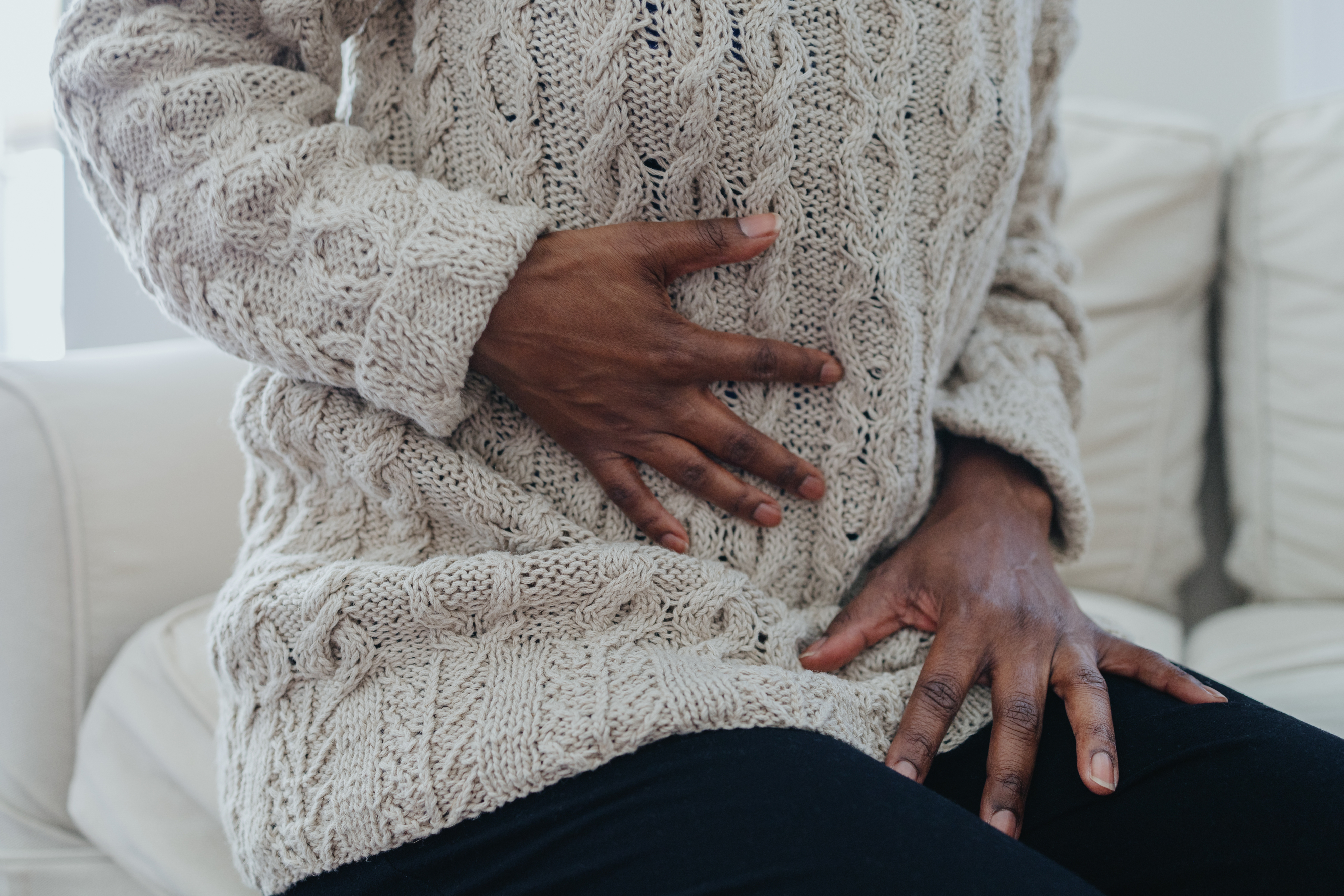 a person touching their stomach