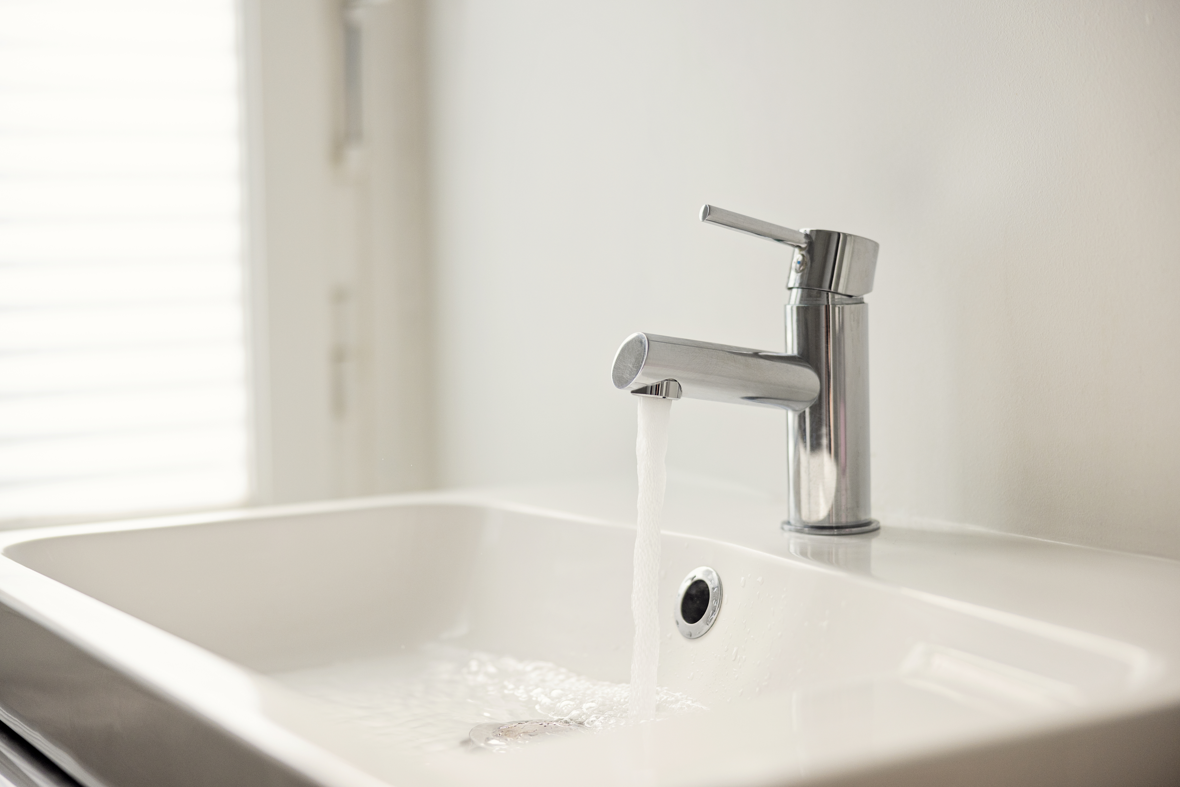 chrome faucet over a bathroom sink