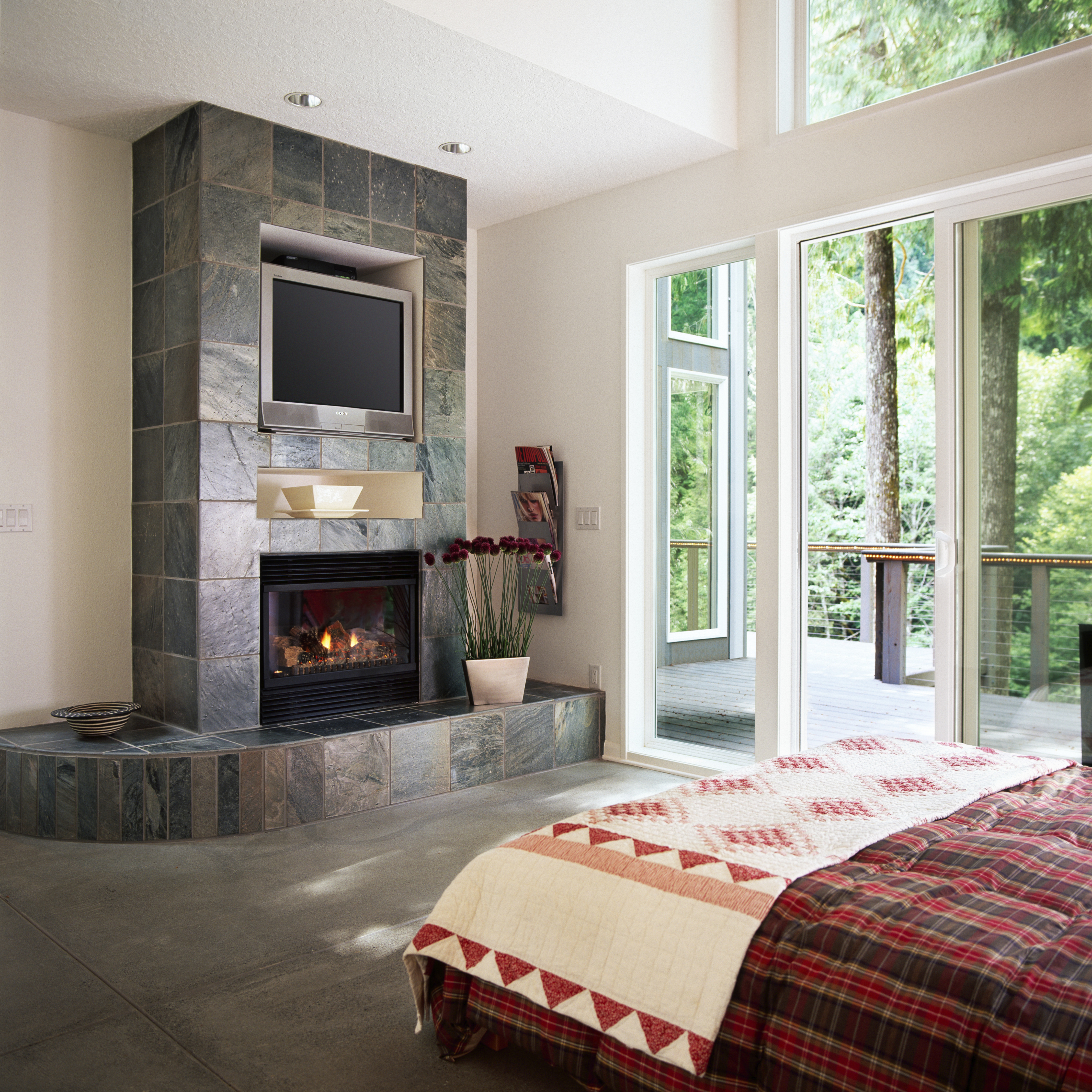 small TV alcove above a fireplace in a bedroom