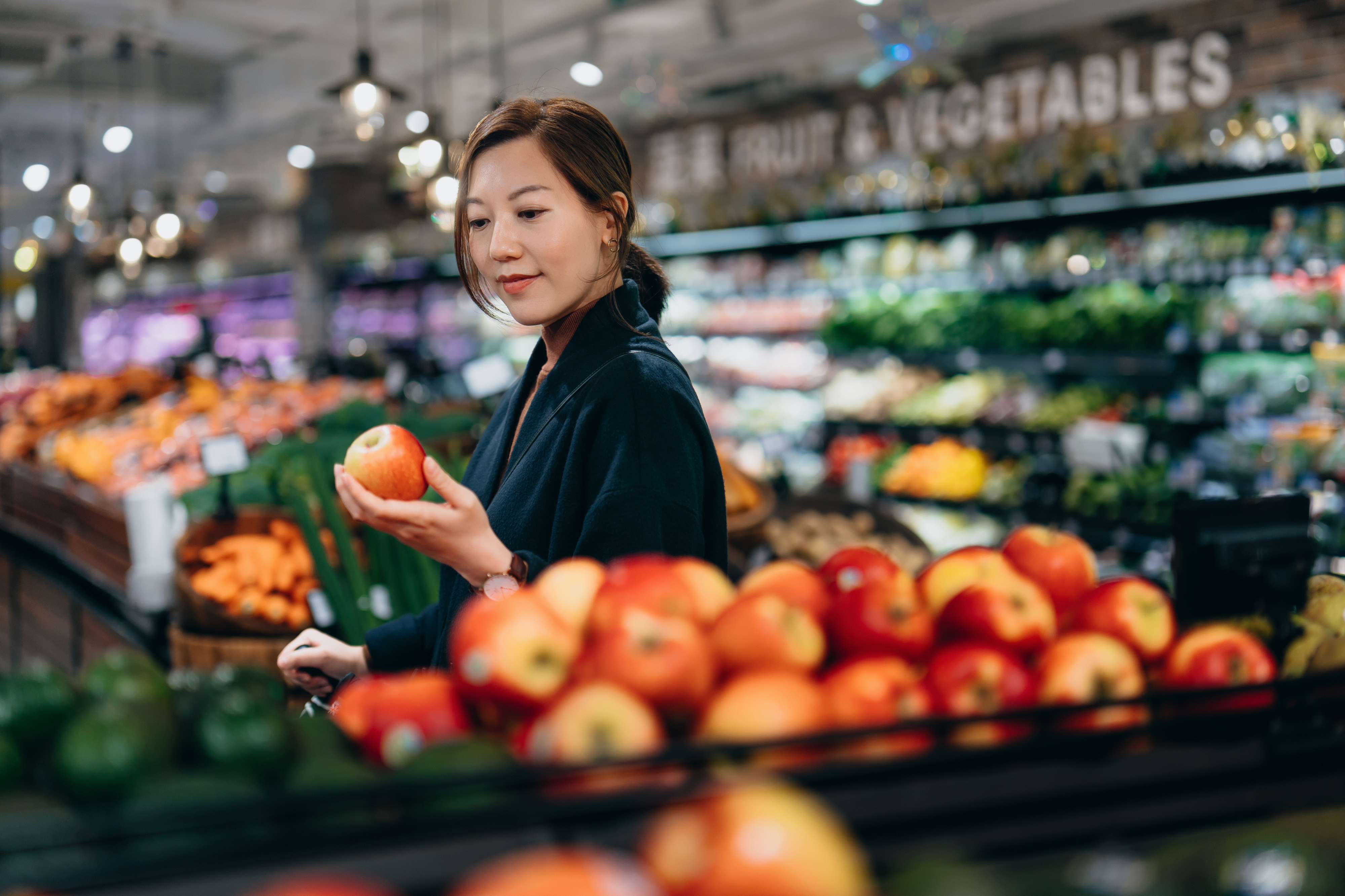 A woman grocery shopping