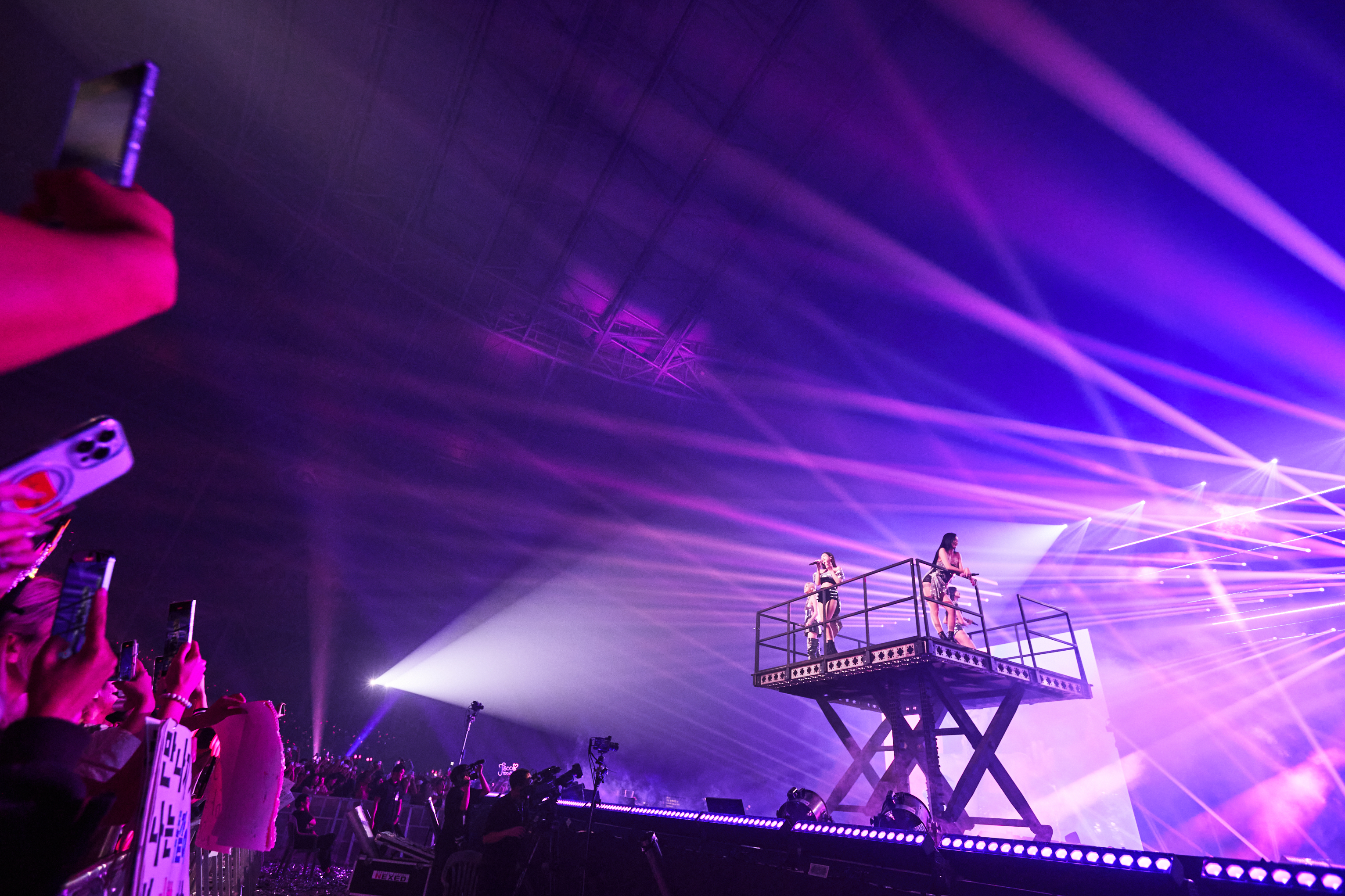 Blackpink on a platform onstage