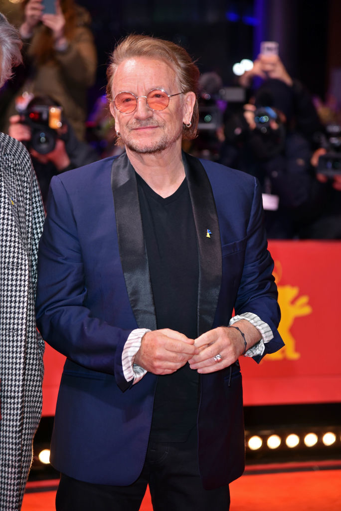 closeup of him in a suit on the red carpet