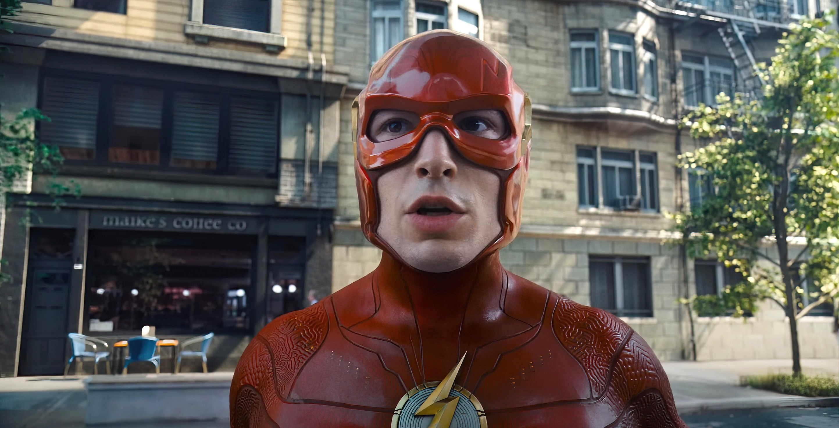 The Flash stands in a street, wearing a detailed superhero suit with a lightning bolt emblem and red mask