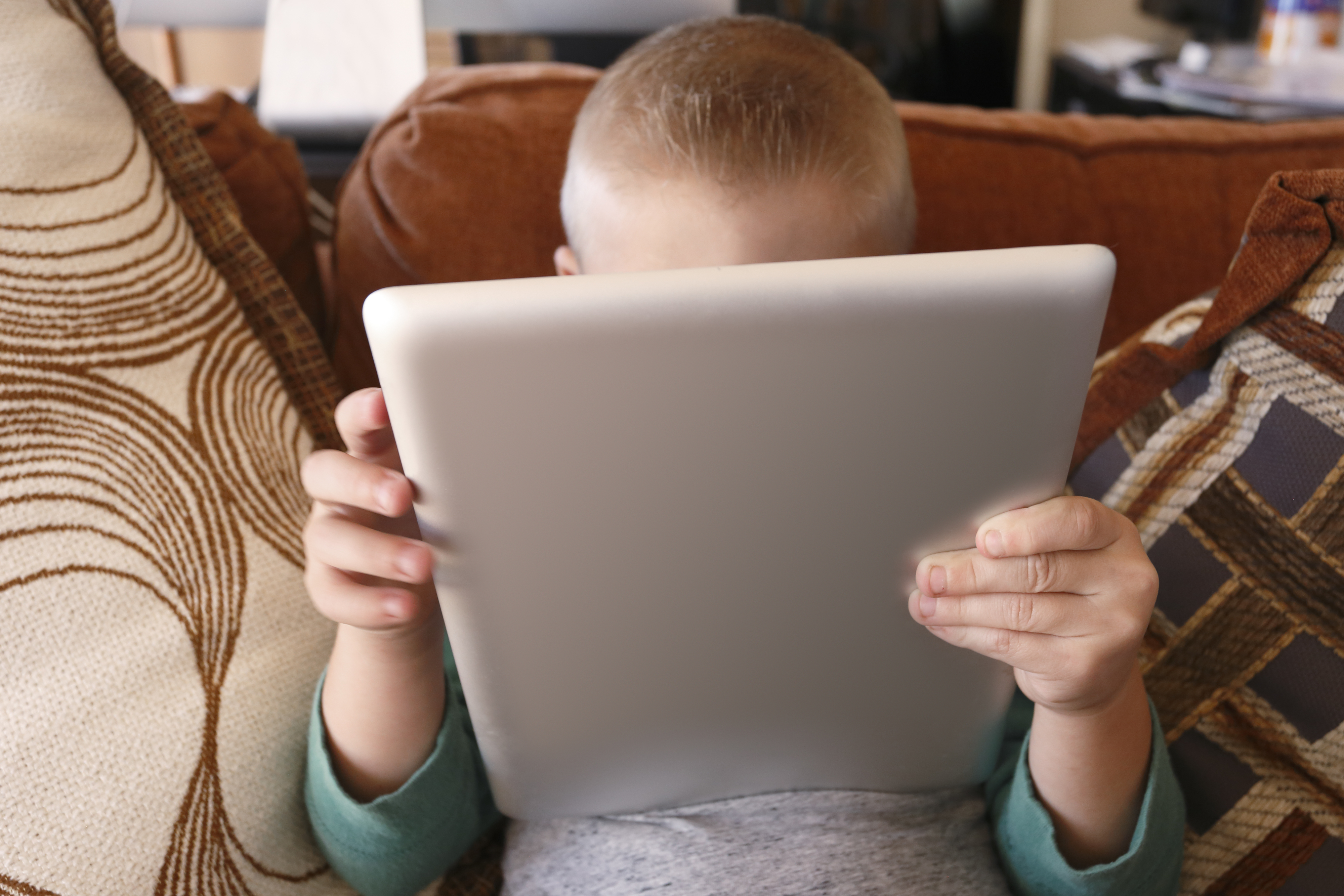 a child in front of an ipad