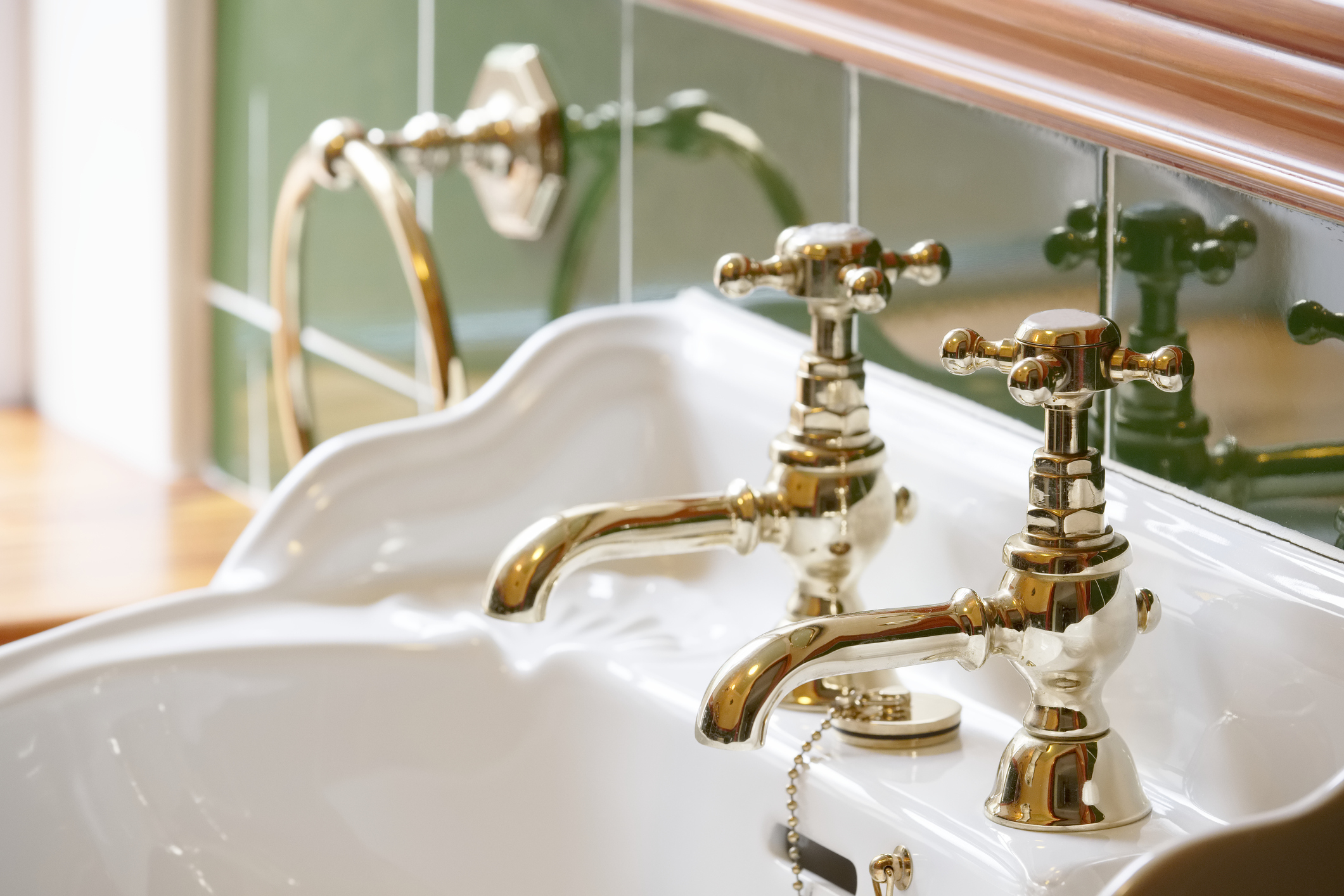 Vintage-style bathroom sink with two separate taps