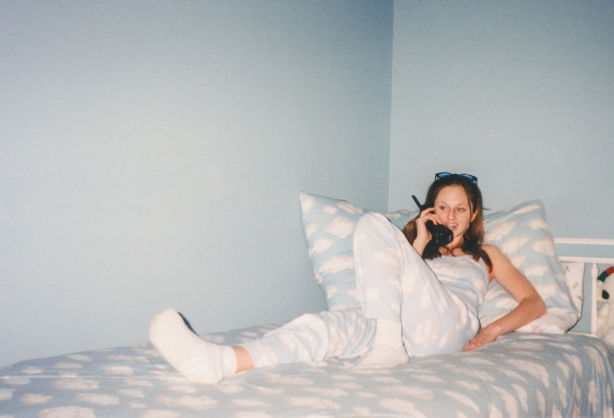 A young woman is talking on the phone