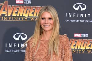 Gwyneth Paltrow at a premiere, wearing a short tasseled dress and strappy heels