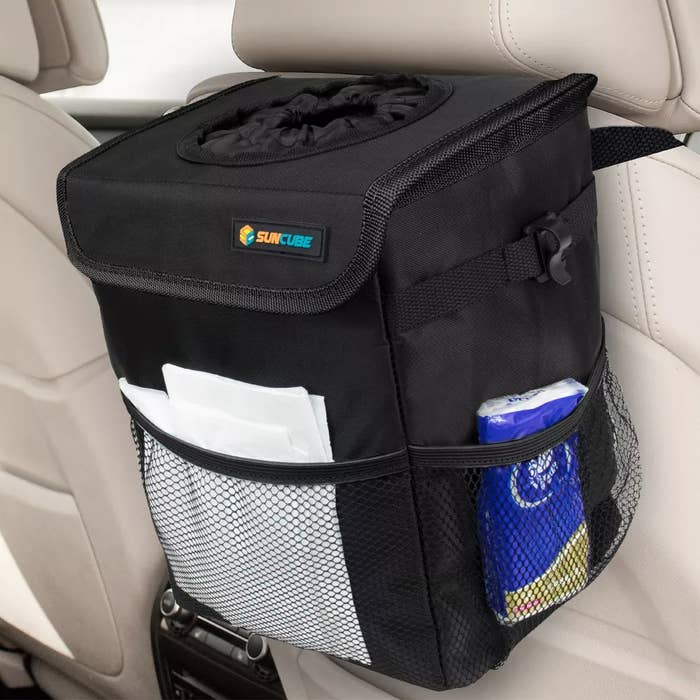 Car backseat organizer with tissue holder and storage pockets, branded with &quot;Sun Cube&quot;