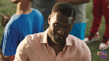GIF of a man holding up a taco from &quot;The Chi&quot;