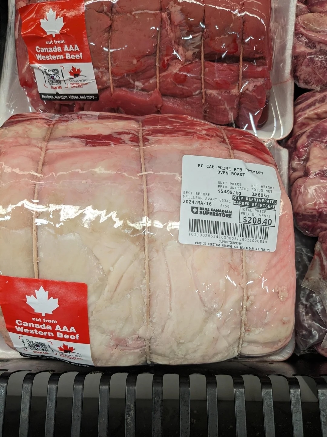 Packaged Canadian beef with a price tag showing $208.40 on a supermarket shelf