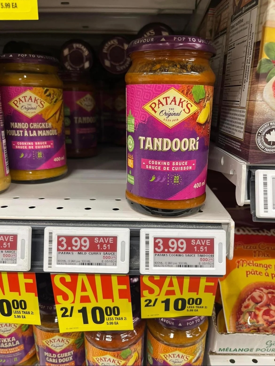Jar of Patak&#x27;s Tandoori sauce on a grocery shelf with a sale price tag displayed below it