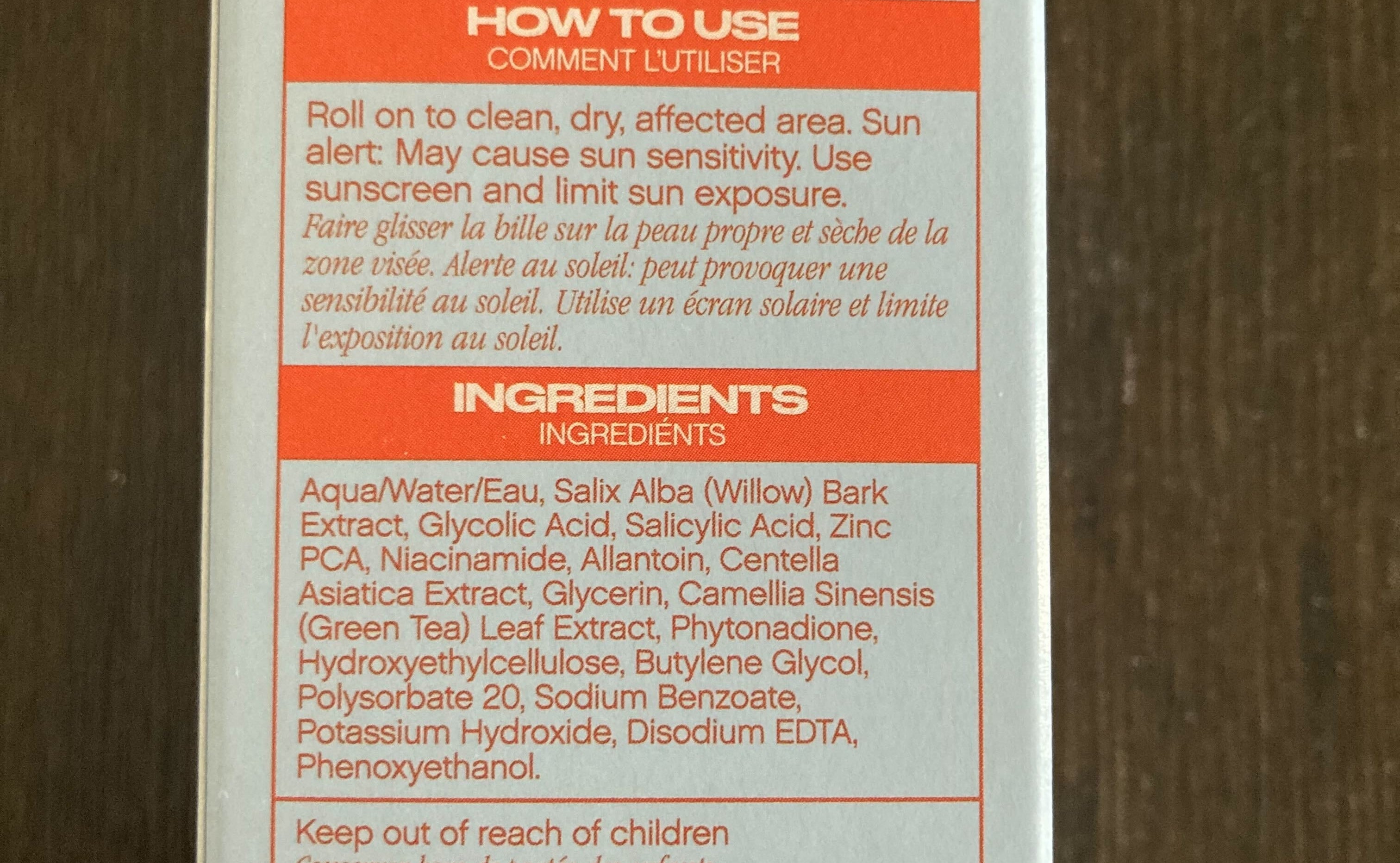 Packaging of topical treatment with usage instructions and ingredient list