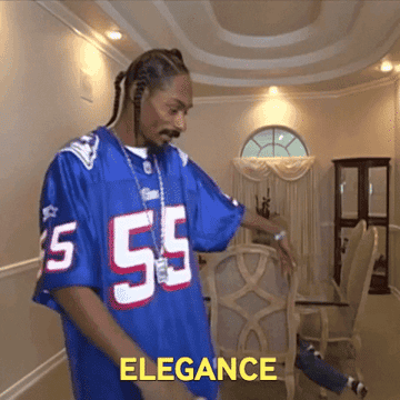 Snoop Dogg in a football jersey playfully motions towards a cat jumping in a dining room, with the text &quot;ELEGANCE&quot; displayed at the bottom