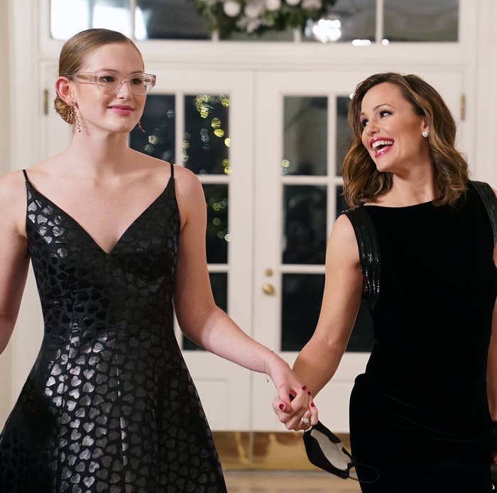 Jennifer Garner and Violet Affleck hold hands at a formal event, both wearing elegant black dresses