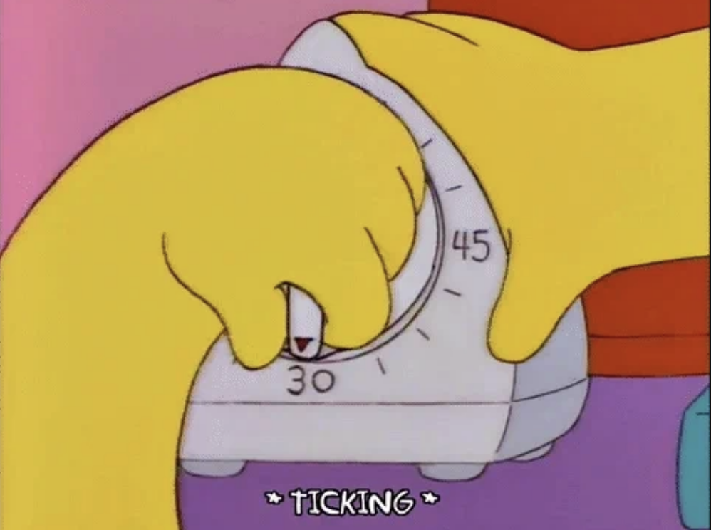 A close-up illustration from The Simpsons shows hands adjusting a timer to 30 minutes. Caption reads &quot;*TICKING*&quot;