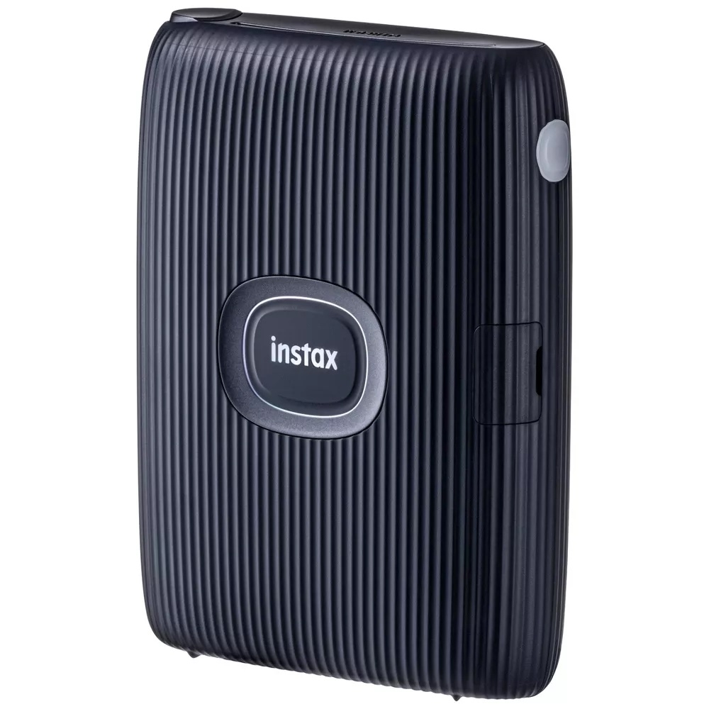 Instax portable printer with a sleek, ribbed design, featured in a Shopping article