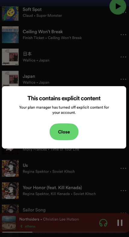 Explicit content warning on a music streaming app indicating explicit content is turned off for the account by the plan manager