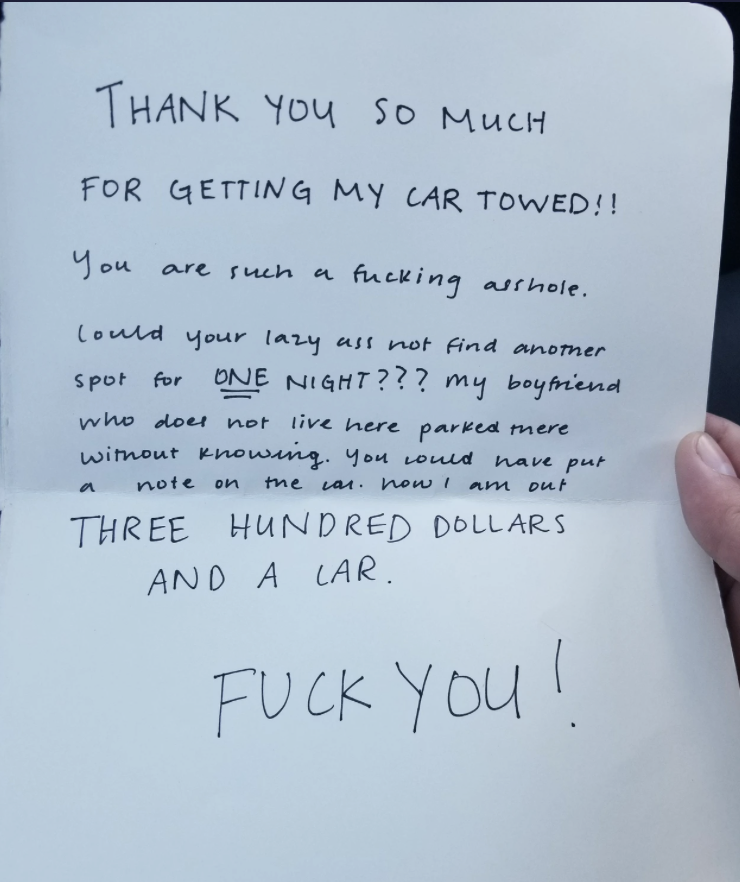 Handwritten note expressing anger over car being towed, mentioning a $300 fine and accusing the reader of inconsideration. Ends with profanity