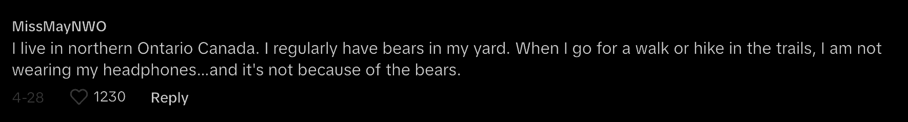 A user named MissMayNNWO comments about walking in northern Ontario, Canada, without headphones despite encountering bears. 1230 likes and 28 replies