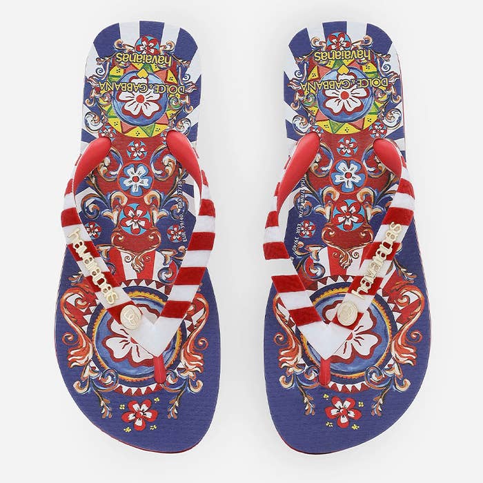 Colorful, patterned Havaianas flip-flops with red and white striped straps and gold decorations