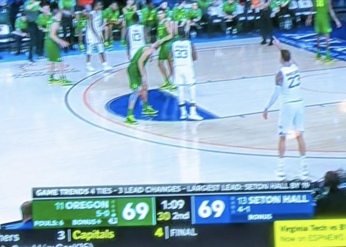 Basketball game between Oregon and Seton Hall with tied score at 69-69. Players are on the court and scoreboard is visible showing time left as 1:09 in the 2nd period