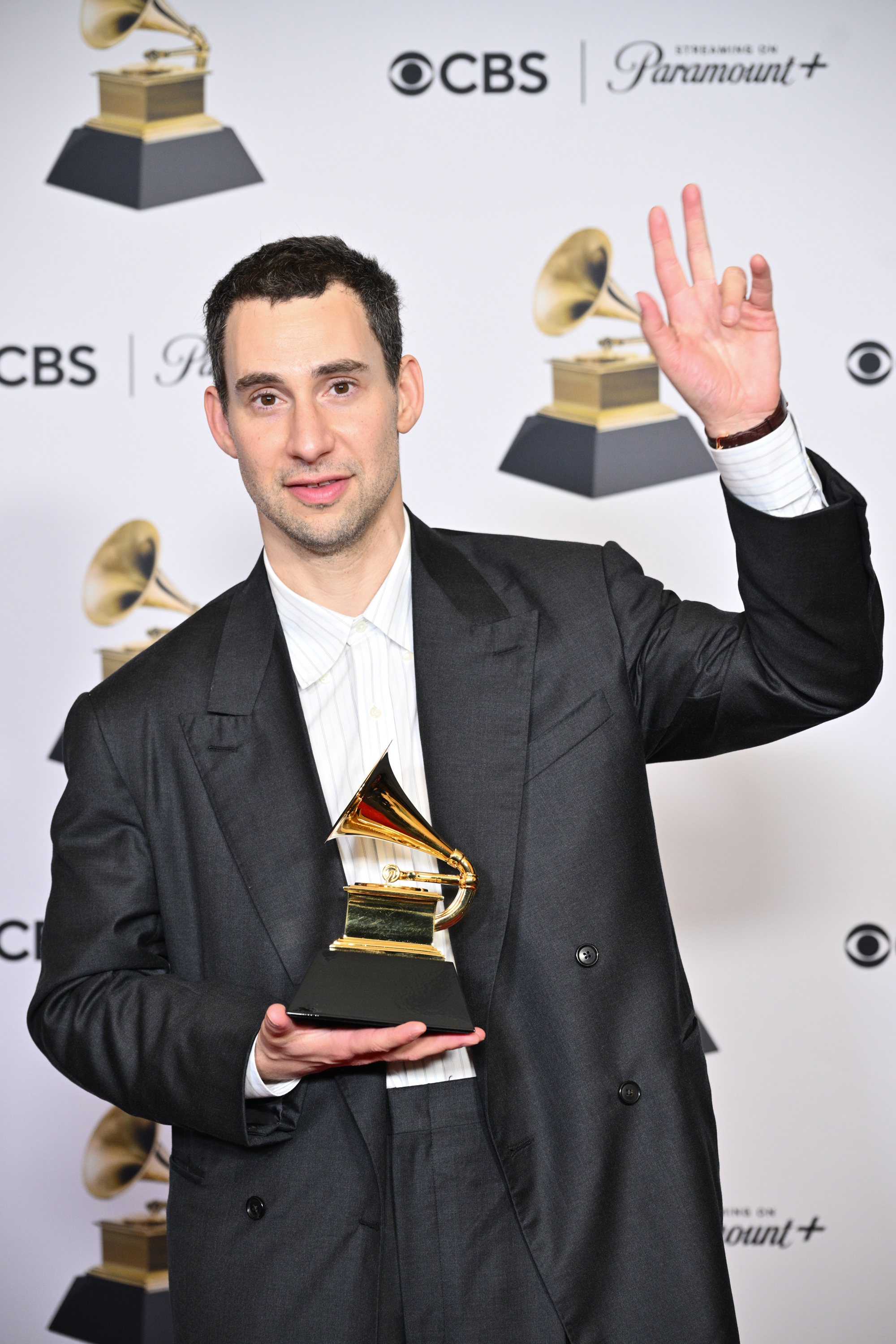 Jack Antonoff holding his Grammy