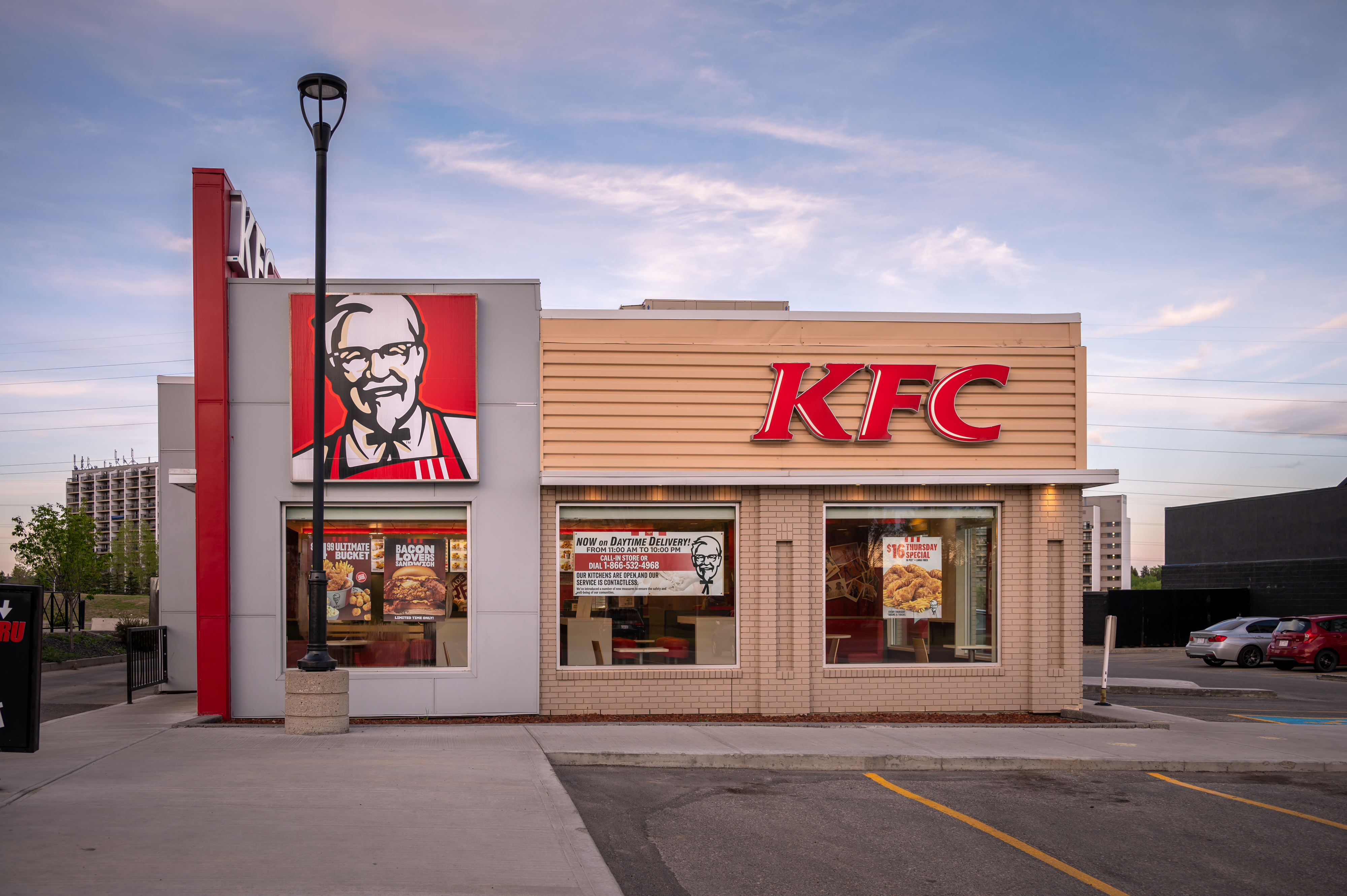 Resized image of a KFC restaurant exterior with Colonel Sanders logo and KFC signage visible