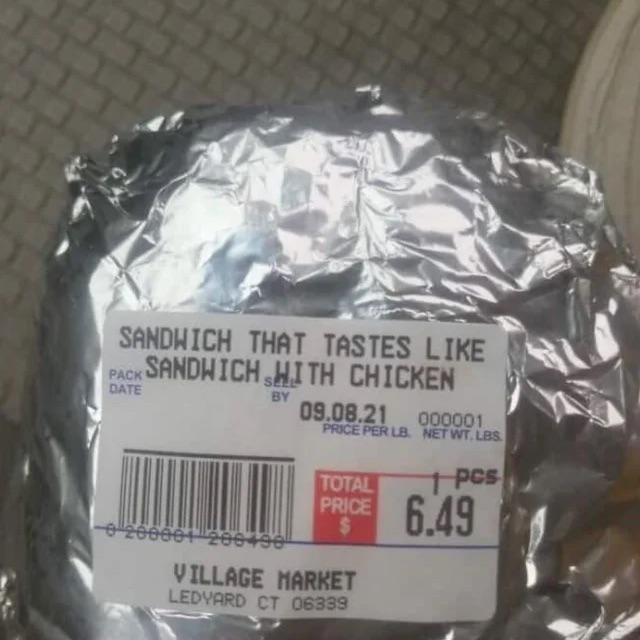 Label on a wrapped item reads: &quot;Sandwich that tastes like sandwich with chicken,&quot; priced at $6.49, from Village Market in Ledyard, CT