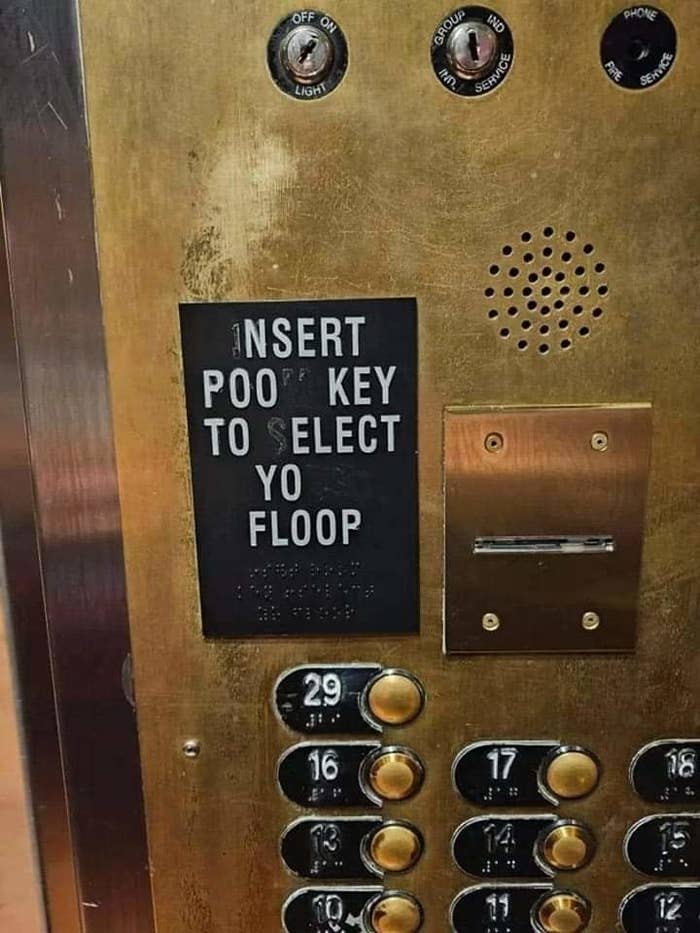 A worn elevator panel with text reading &quot;Insert poop key to select yo floop,&quot; showing buttons for floors 1-20 but with numbers 12, 17, 18, and 19 missing