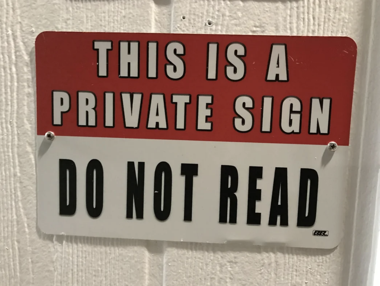 Sign with text: &quot;THIS IS A PRIVATE SIGN. DO NOT READ.&quot;