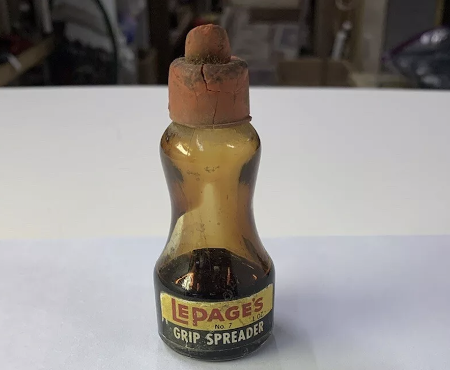 Vintage Lepages Grip Spreader No. 7 bottle with a weathered plug cap, seen in a nostalgic article categorized as Rewind