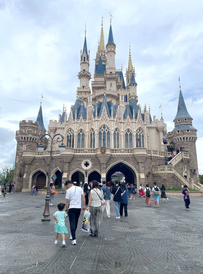 People walking towards Cinderella Castle at Disney&#x27;s Magic Kingdom