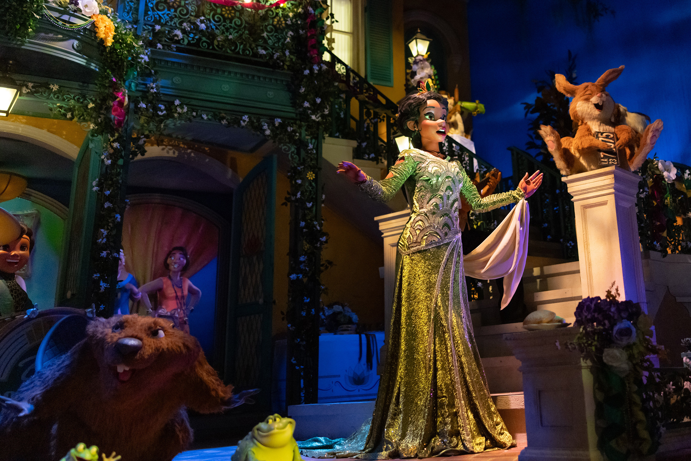 Animated characters from Disney&#x27;s &quot;The Princess and the Frog,&quot; with Princess Tiana singing on a balcony, surrounded by animal friends