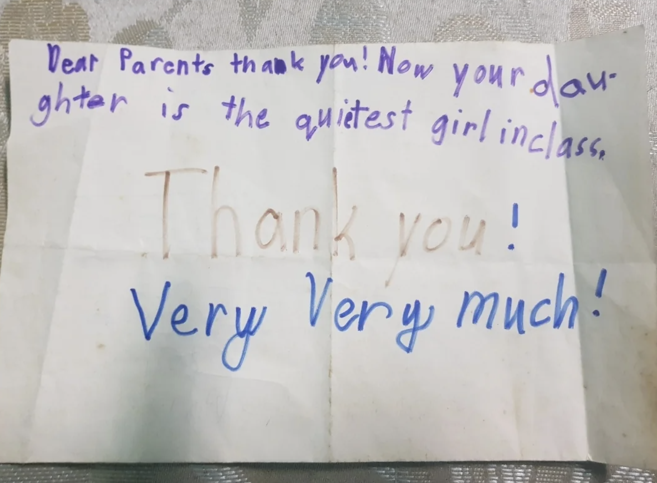 A handwritten note reads: &quot;Dear Parents thank you! Now your daughter is the quietest girl in class. Thank you! Very Very much!&quot;