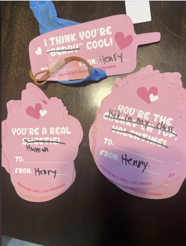 Three handmade Valentine cards, each addressed to &quot;Henry&quot;. The cards feature playful messages, stickers, and a rubber band