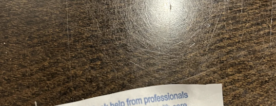 Fortune cookie message on wooden table reads: &quot;Seek help from professionals trained in mental health care.&quot;