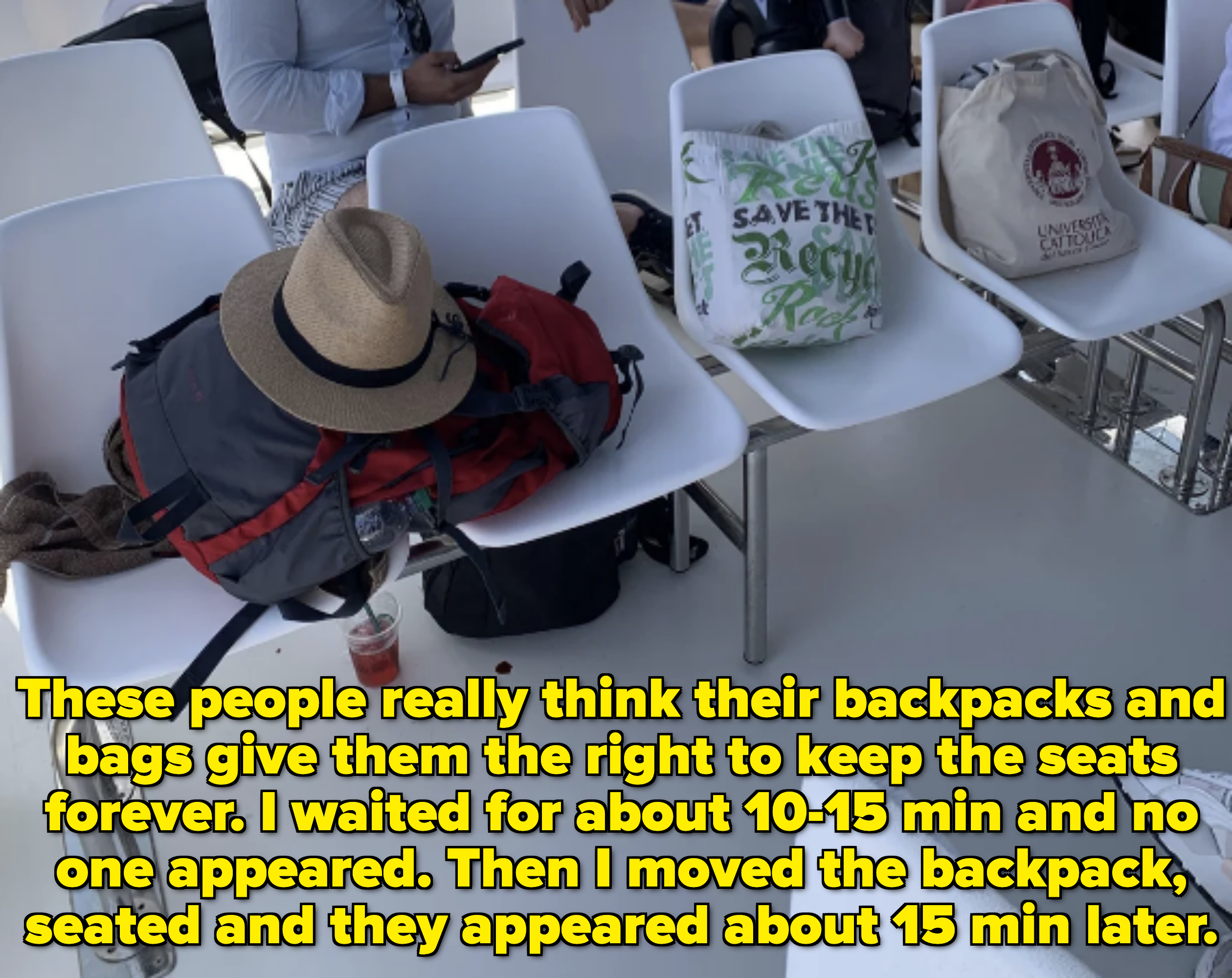 Several personal items, including a backpack, hat, and tote bags placed on white chairs in an outdoor setting. People are partially visible in the background