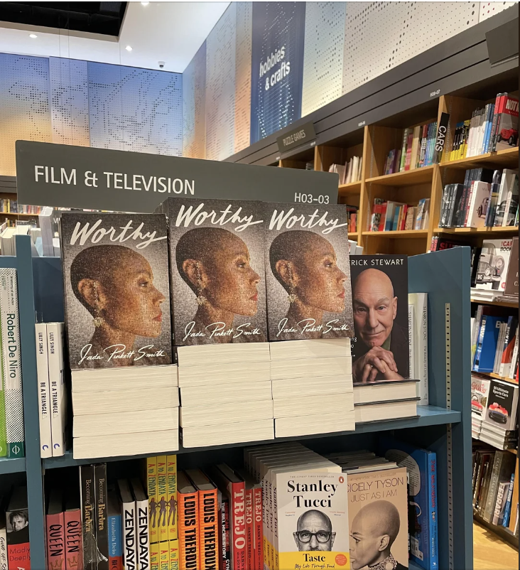 Books for sale in a bookstore. Prominent displays include Jada Pinkett Smith&#x27;s &quot;Worthy&quot; and Patrick Stewart&#x27;s &quot;Making It So.&quot; Other books by Stanley Tucci and Quentin Tarantino