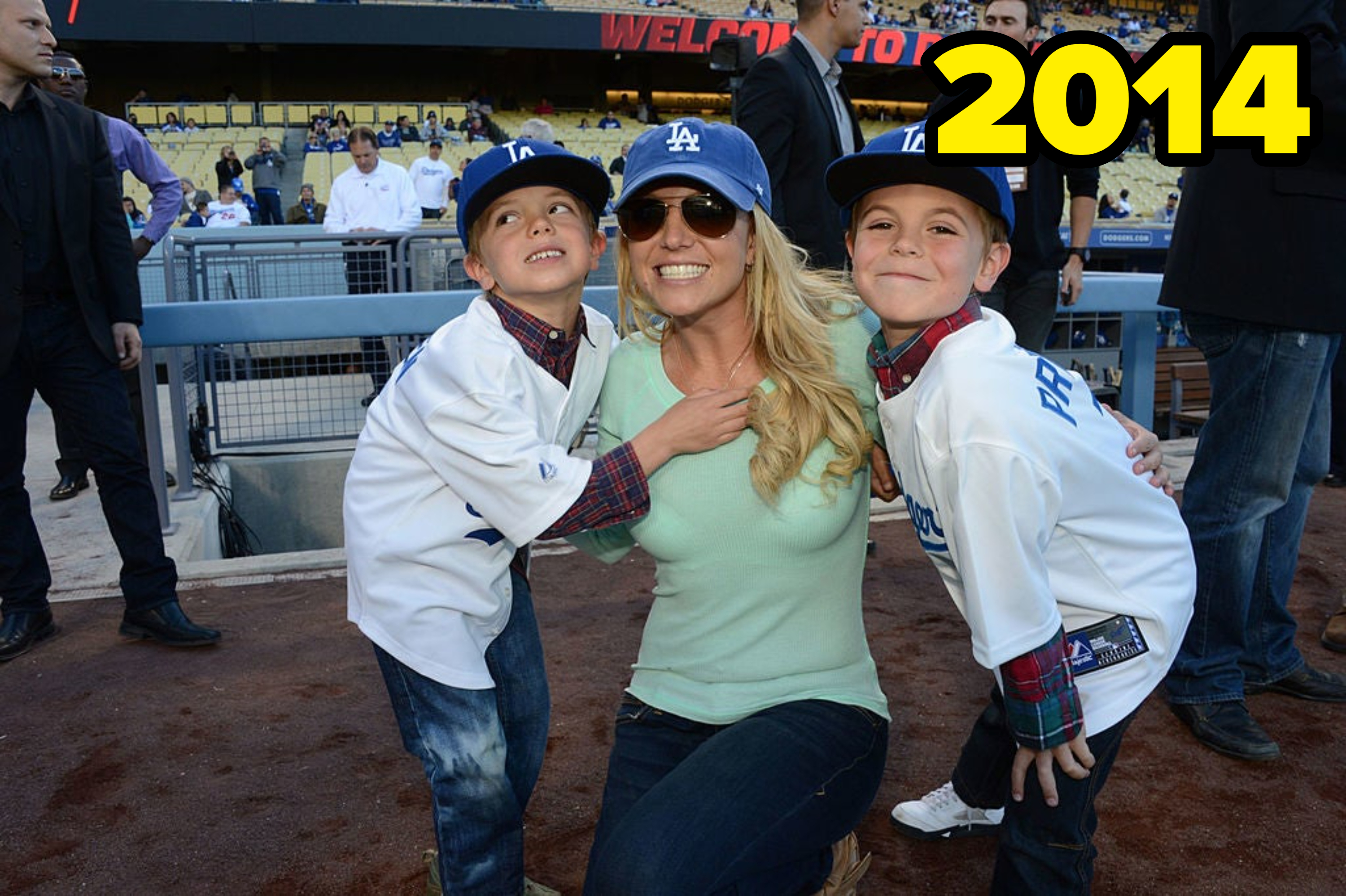 Britney Spears poses with her sons, Sean Preston and Jayden James, in 2014 wearing baseball gear at Dodger Stadium