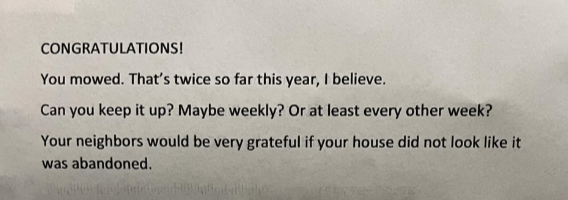 Text congratulating someone on mowing twice this year and suggesting more frequent mowing to prevent the house from looking abandoned